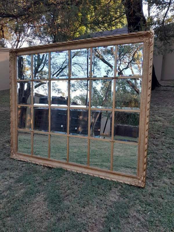 A French Style Heavily Carved and Gilded Framed Mirror with Bevelled Mirror Panes of Large Propor...
