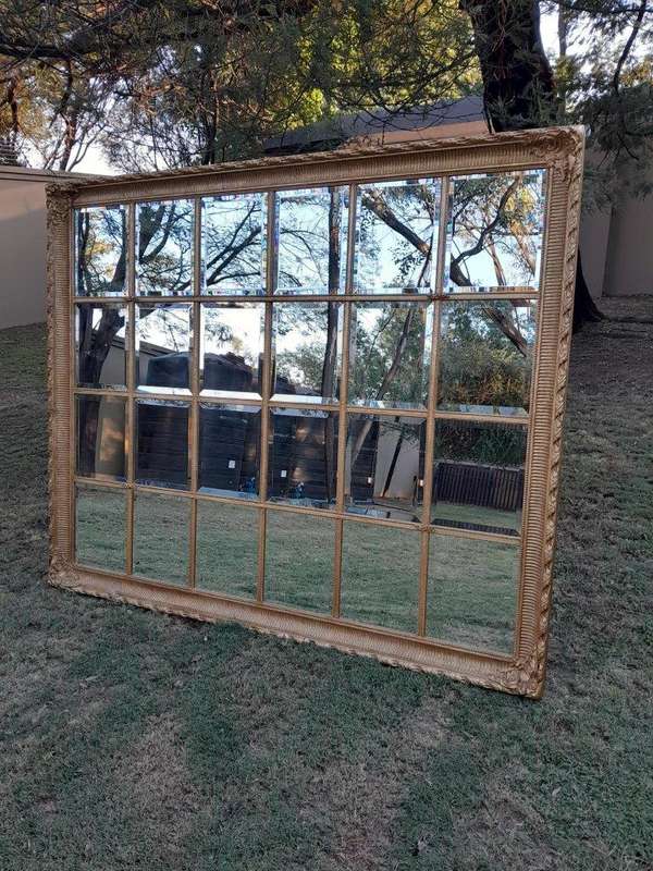 A French Style Heavily Carved and Gilded Framed Mirror with Bevelled Mirror Panes of Large Propor...