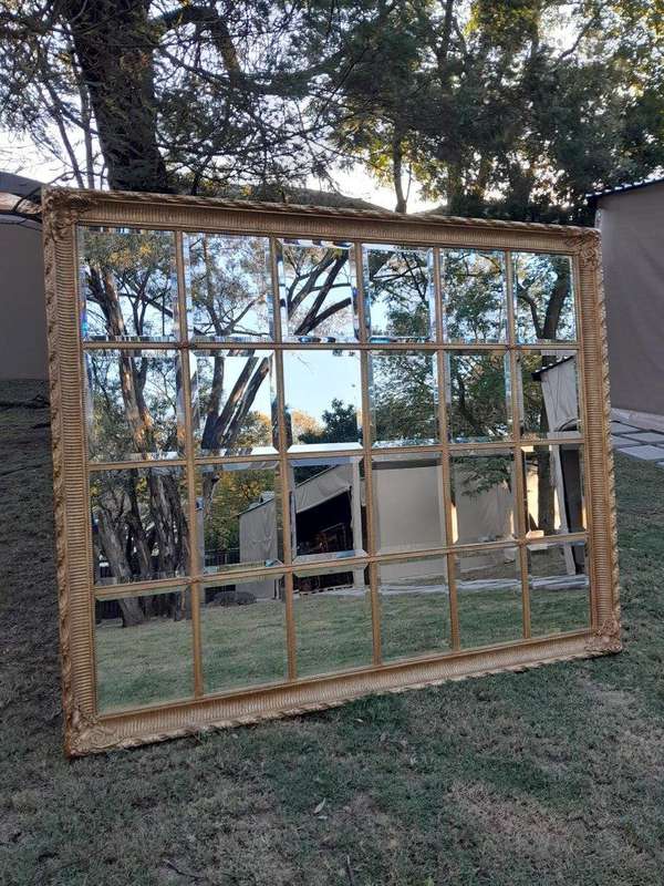 A French Style Heavily Carved and Gilded Framed Mirror with Bevelled Mirror Panes of Large Propor...
