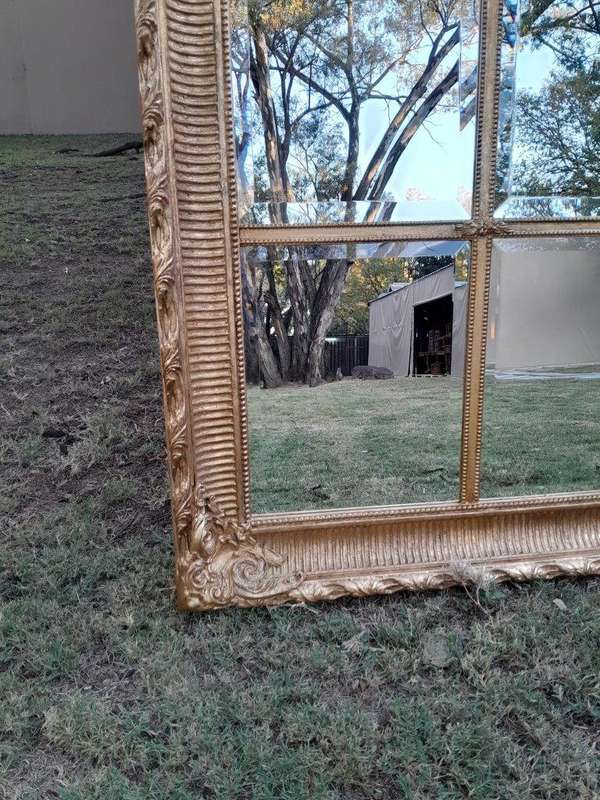 A French Style Heavily Carved and Gilded Framed Mirror with Bevelled Mirror Panes of Large Propor...