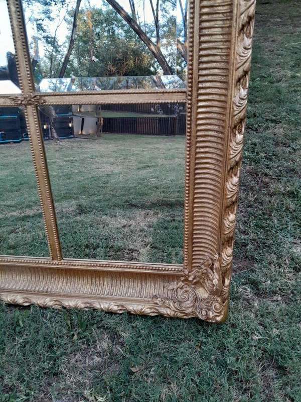 A French Style Heavily Carved and Gilded Framed Mirror with Bevelled Mirror Panes of Large Propor...