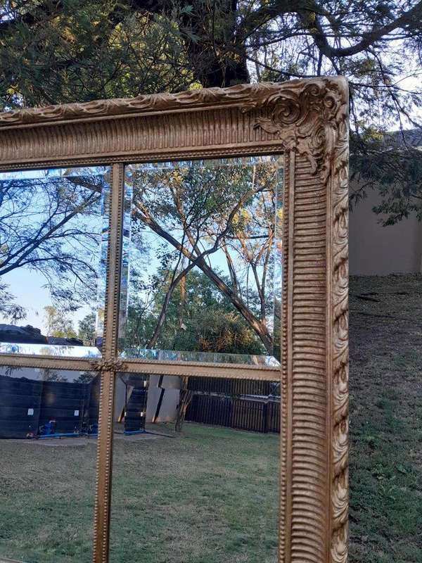 A French Style Heavily Carved and Gilded Framed Mirror with Bevelled Mirror Panes of Large Propor...