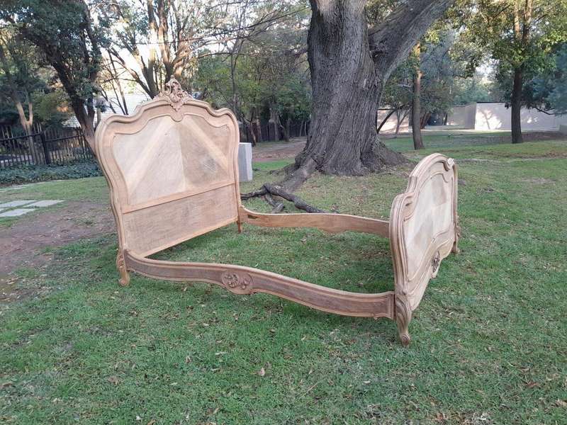 A 20TH Century Walnut Rococo Style Bed in a Contemporary Bleached Finish