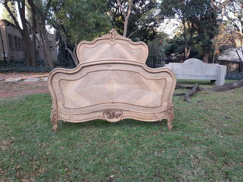 A 20TH Century Walnut Rococo Style Bed in a Contemporary Bleached Finish