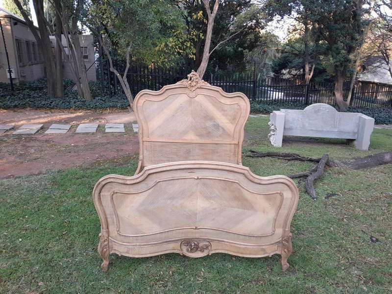 A 20TH Century Walnut Rococo Style Bed in a Contemporary Bleached Finish