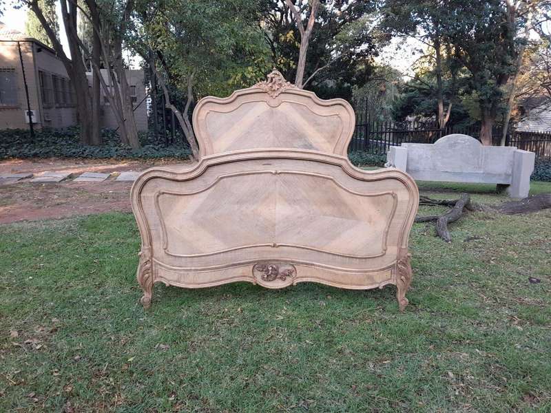 A 20TH Century Walnut Rococo Style Bed in a Contemporary Bleached Finish