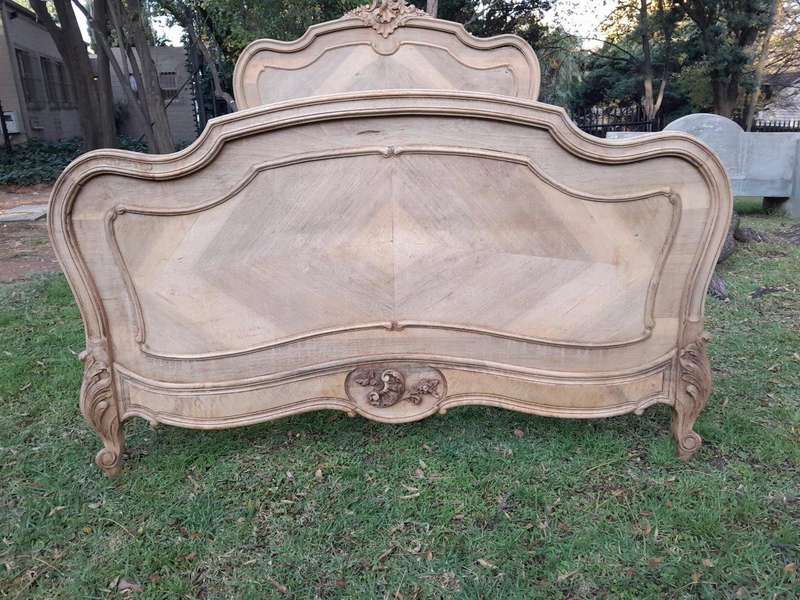 A 20TH Century Walnut Rococo Style Bed in a Contemporary Bleached Finish