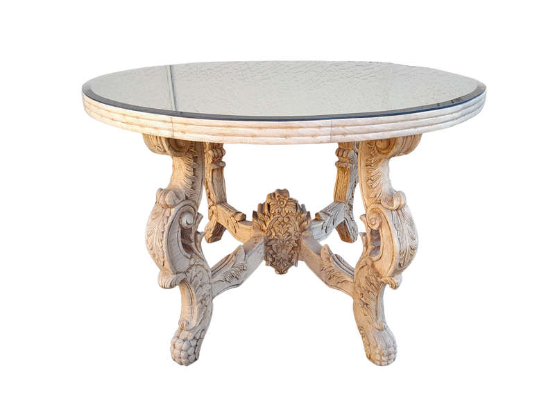 A 20th Century Ornately Carved Circular Wooden Table In A Contemporary Bleached Finish And With A...