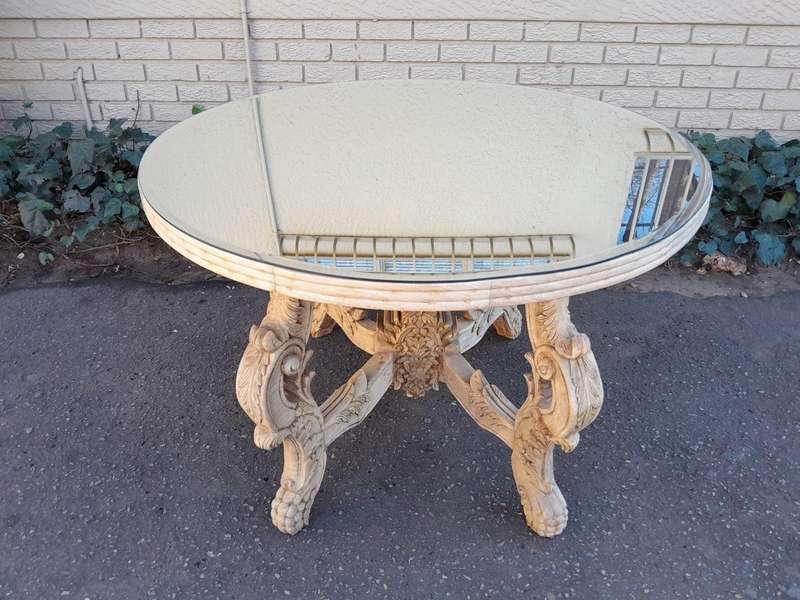 A 20th Century Ornately Carved Circular Wooden Table In A Contemporary Bleached Finish And With A...
