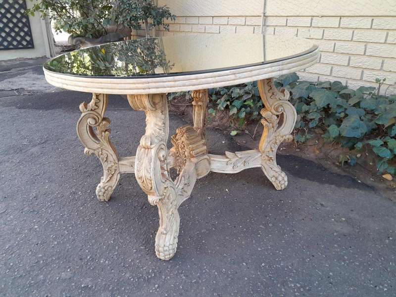 A 20th Century Ornately Carved Circular Wooden Table In A Contemporary Bleached Finish And With A...