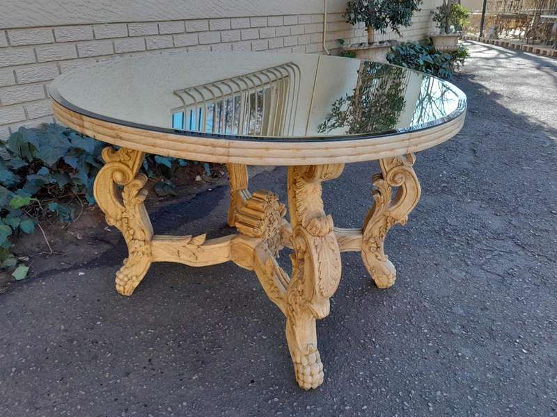 A 20th Century Ornately Carved Circular Wooden Table In A Contemporary Bleached Finish And With A...