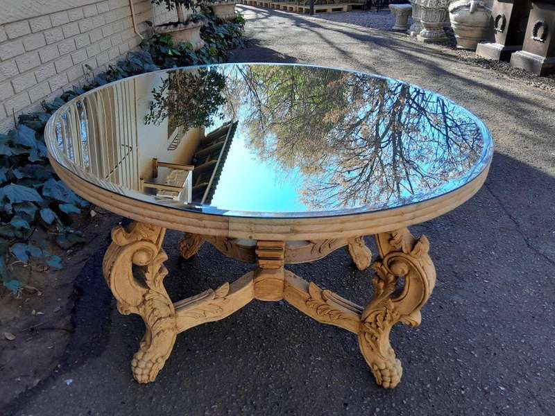 A 20th Century Ornately Carved Circular Wooden Table In A Contemporary Bleached Finish And With A...