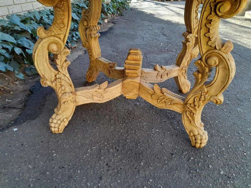 A 20th Century Ornately Carved Circular Wooden Table In A Contemporary Bleached Finish And With A...