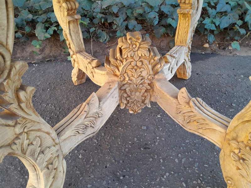 A 20th Century Ornately Carved Circular Wooden Table In A Contemporary Bleached Finish And With A...