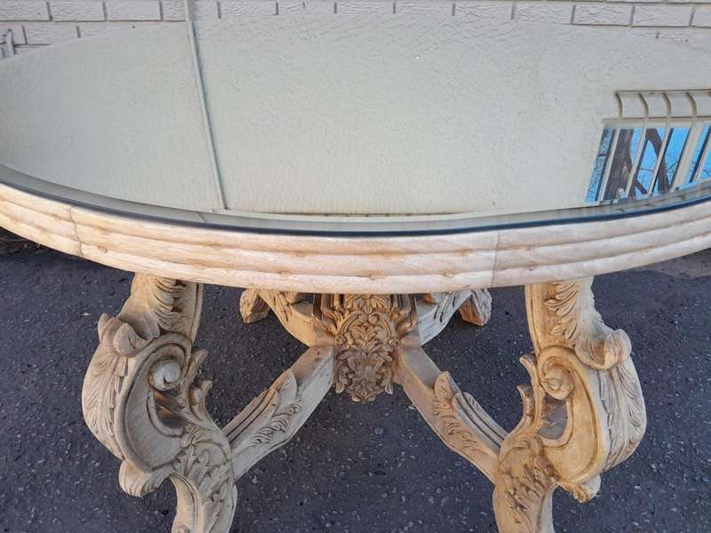 A 20th Century Ornately Carved Circular Wooden Table In A Contemporary Bleached Finish And With A...