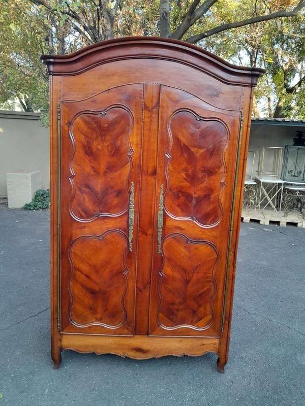 An Early 19th Century French Walnut and Cherrywood Port Armoire with Original Brass Fittings