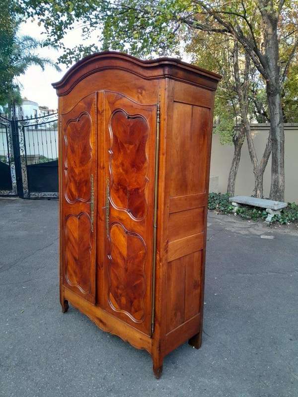An Early 19th Century French Walnut and Cherrywood Port Armoire with Original Brass Fittings