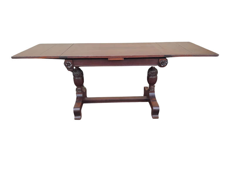 An Antique Edwardian Oak Dining Table With Two Extension Leaves