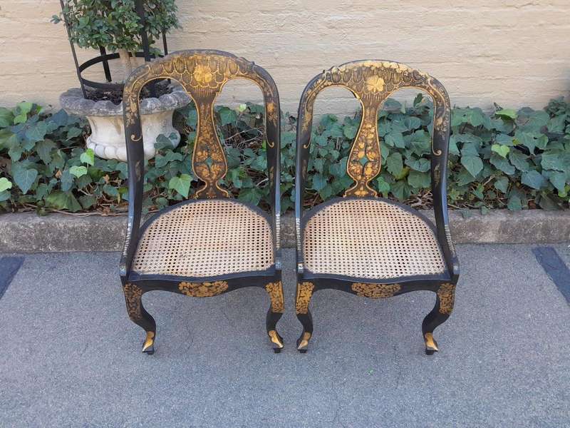 A Late 19th Century Pair of Chinoiserie Ebonised Mahogany Chairs with Rattan Seats