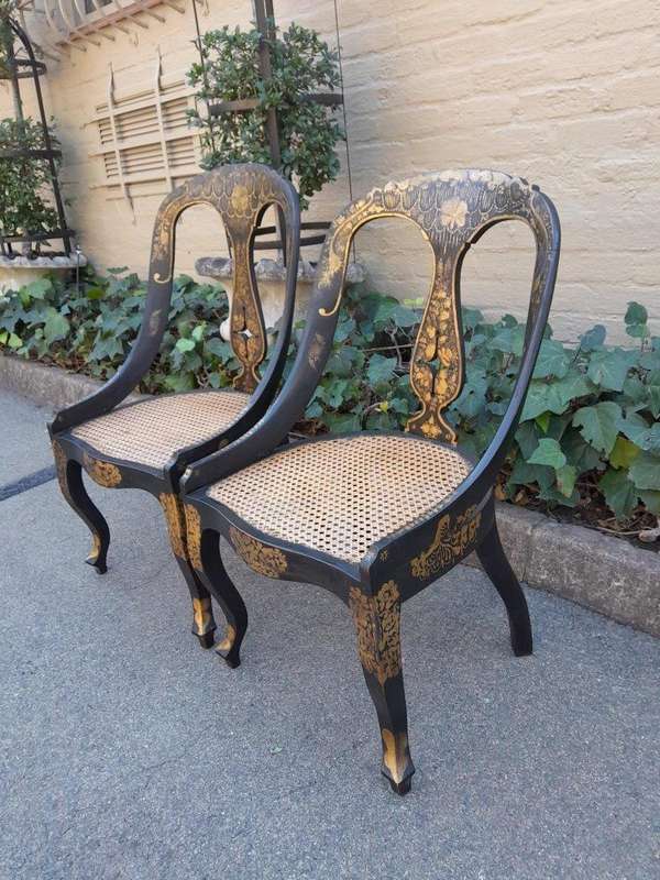 A Late 19th Century Pair of Chinoiserie Ebonised Mahogany Chairs with Rattan Seats