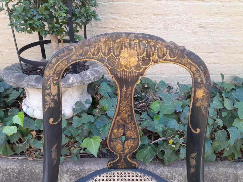A Late 19th Century Pair of Chinoiserie Ebonised Mahogany Chairs with Rattan Seats