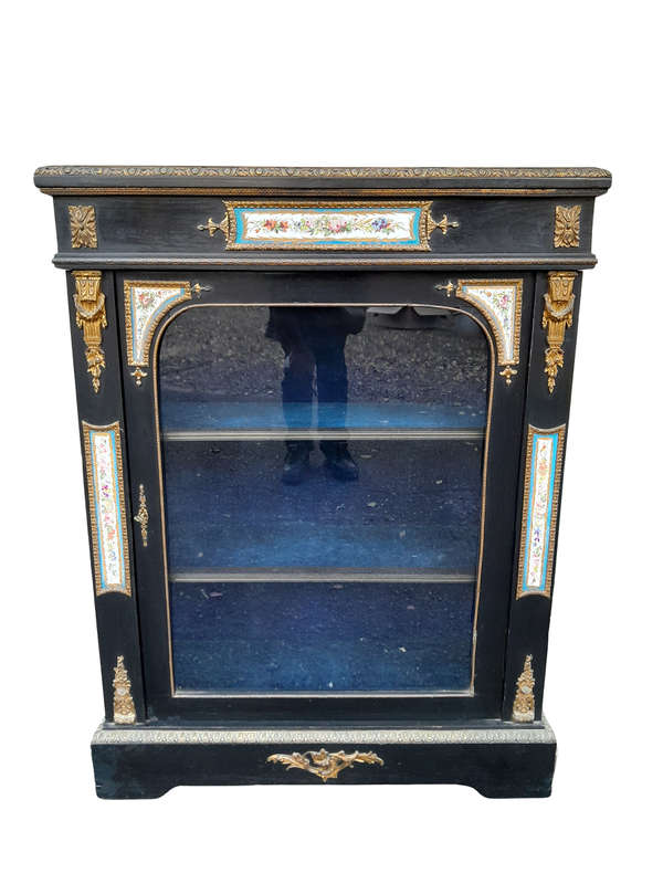 A 19th Century French Ebonised Pier Cabinet And Ormolu Mounts And Porcelain
