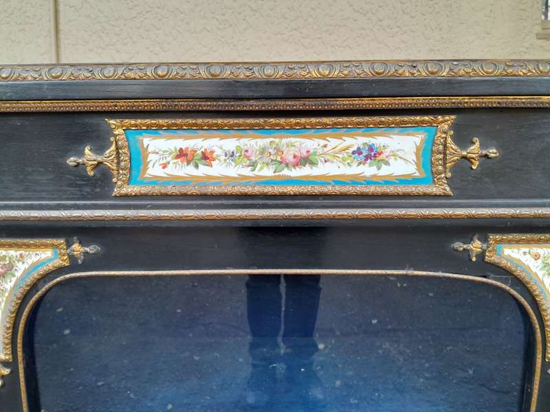 A 19th Century French Ebonised Pier Cabinet And Ormolu Mounts And Porcelain
