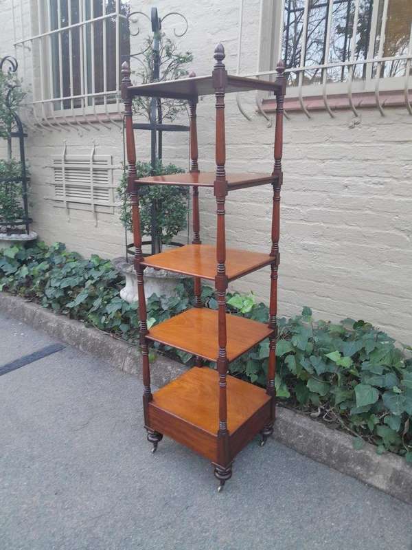 A 20th Century Mahogany Display Stand With Castors