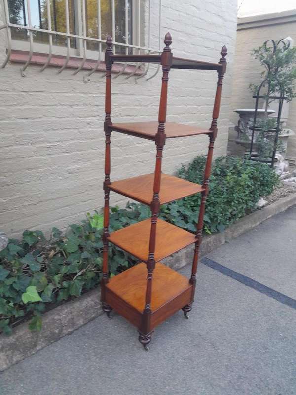 A 20th Century Mahogany Display Stand With Castors