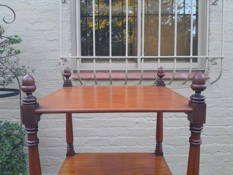 A 20th Century Mahogany Display Stand With Castors
