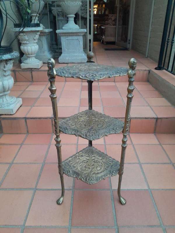 A 20th Century Chinoiserie Brass Stand On Paw Feet