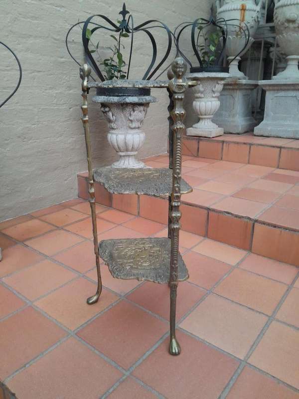 A 20th Century Chinoiserie Brass Stand On Paw Feet