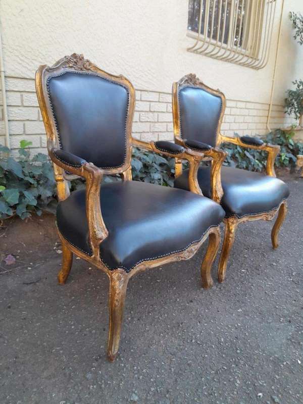 An Early 20th Century Pair of French Giltwood Bergere Armchairs Upholstered in Leather