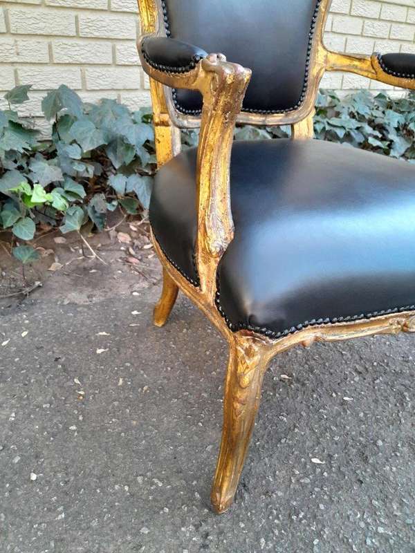 An Early 20th Century Pair of French Giltwood Bergere Armchairs Upholstered in Leather