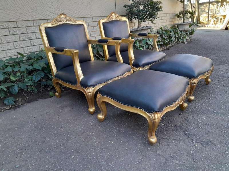 A 20th Century Near Pair  Of Victorian Style Hand-Gilded Mahogany Armchairs And Ottomans Upholst...