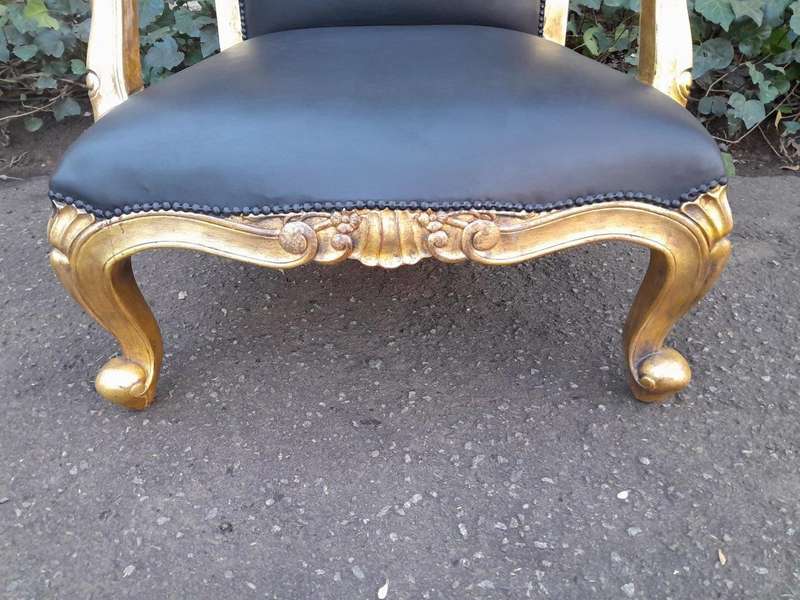 A 20th Century Near Pair  Of Victorian Style Hand-Gilded Mahogany Armchairs And Ottomans Upholst...