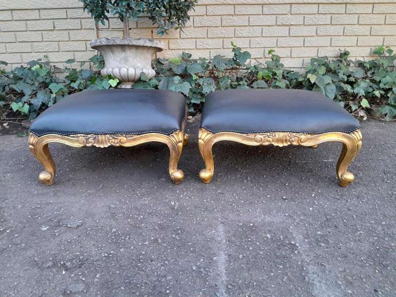 A 20th Century Near Pair  Of Victorian Style Hand-Gilded Mahogany Armchairs And Ottomans Upholst...