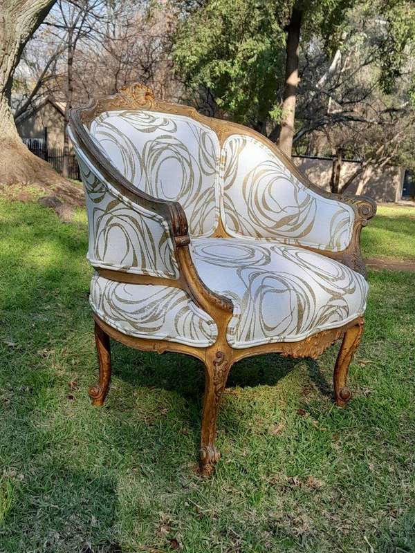 A Late 19th Century French Carved and Gilt Wood Walnut Bergere Armchair  Upholstered in  a cust...