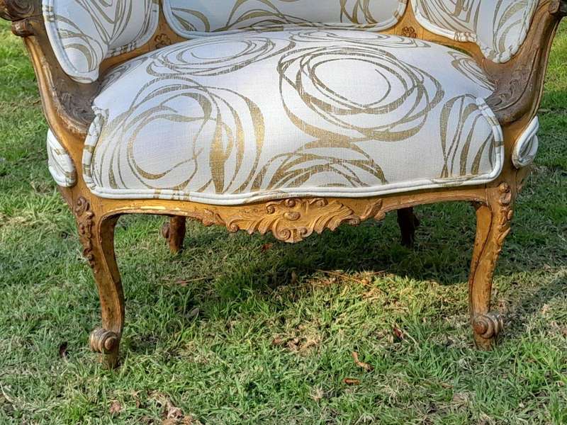 A Late 19th Century French Carved and Gilt Wood Walnut Bergere Armchair  Upholstered in  a cust...