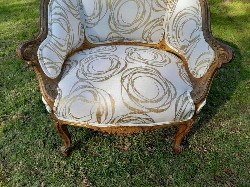 A Late 19th Century French Carved and Gilt Wood Walnut Bergere Armchair  Upholstered in  a cust...