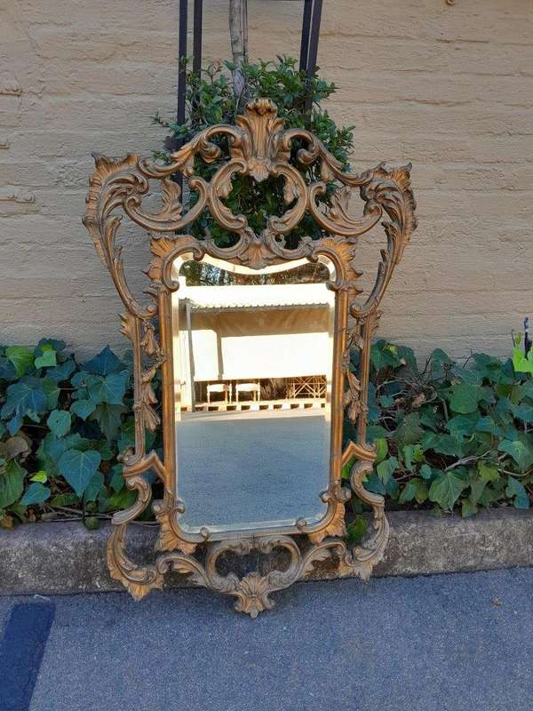 A 20th Century French Style Ornately Carved And Gilt Painted Wooden Mirror