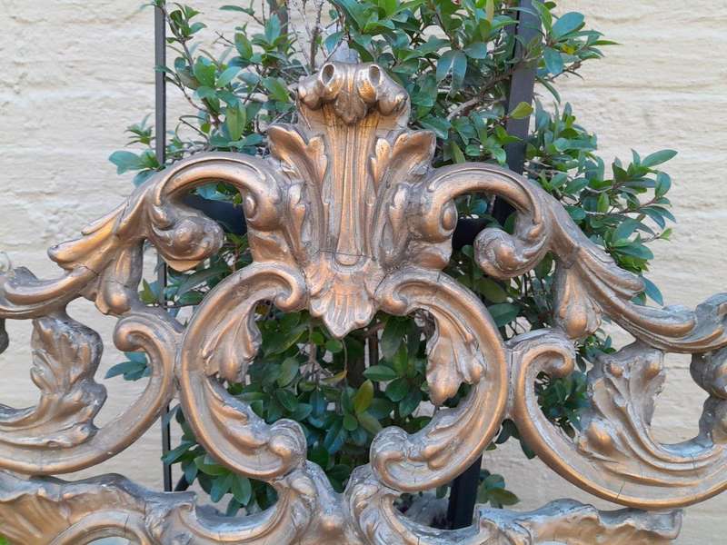 A 20th Century French Style Ornately Carved And Gilt Painted Wooden Mirror