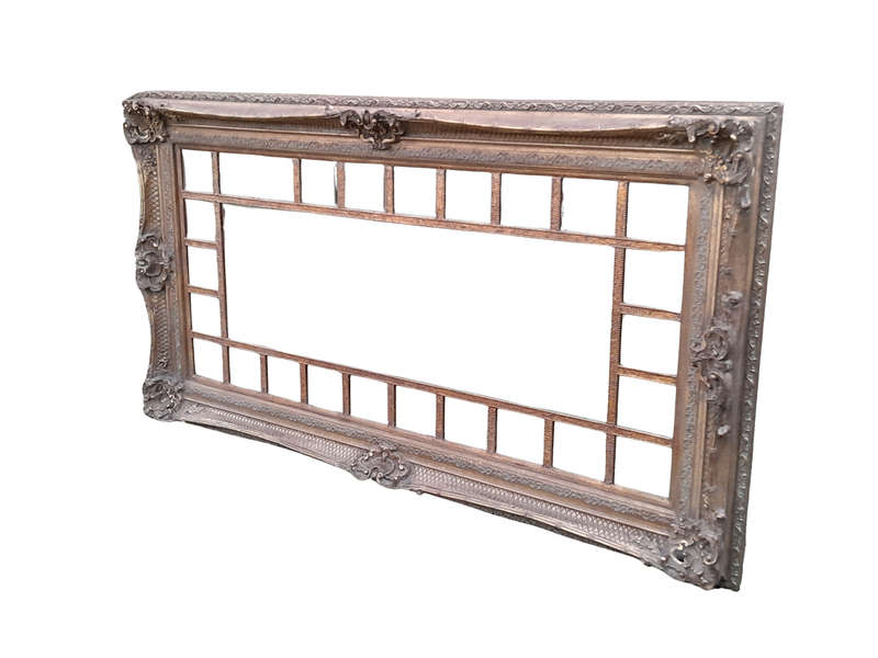 A 20th Century French Style Ornately Carved, Gilt Painted And Bevelled Mirror Of Large Proportions