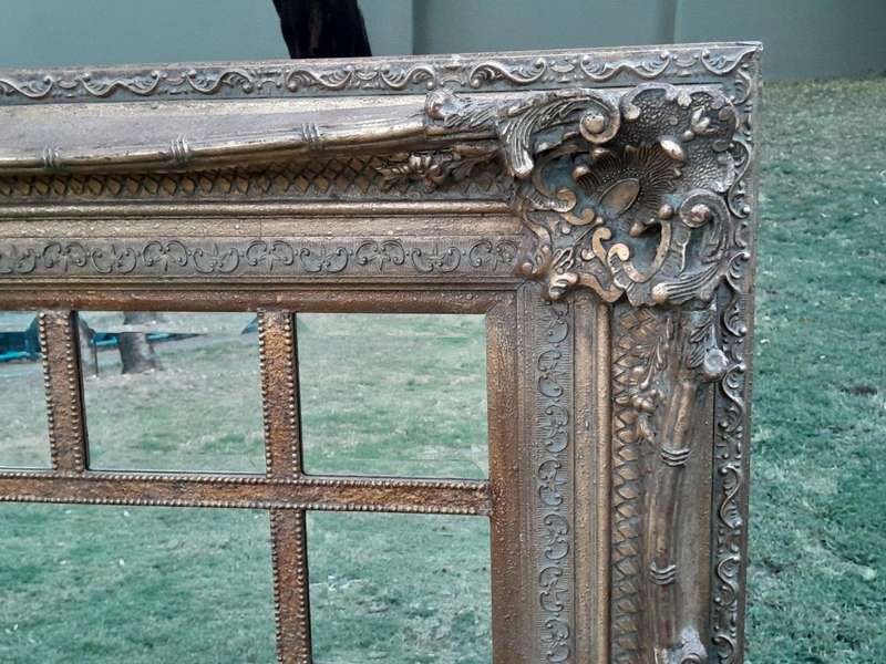 A 20th Century French Style Ornately Carved, Gilt Painted And Bevelled Mirror Of Large Proportions