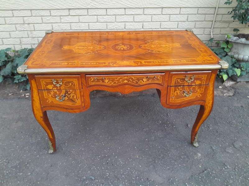 A 20th Century French Style Mahogany And Mahogany Marquetry Inlaid Desk With Brass Caps And Drawers