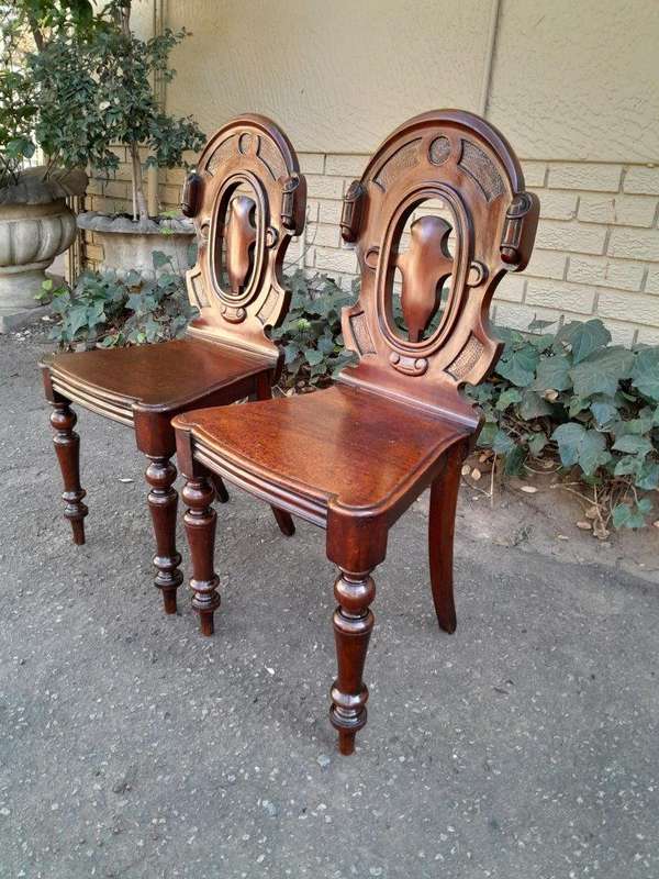 A  20TH Century Pair  of Victorian Carved Mahogany Hall Chairs