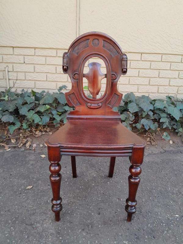 A  20TH Century Pair  of Victorian Carved Mahogany Hall Chairs