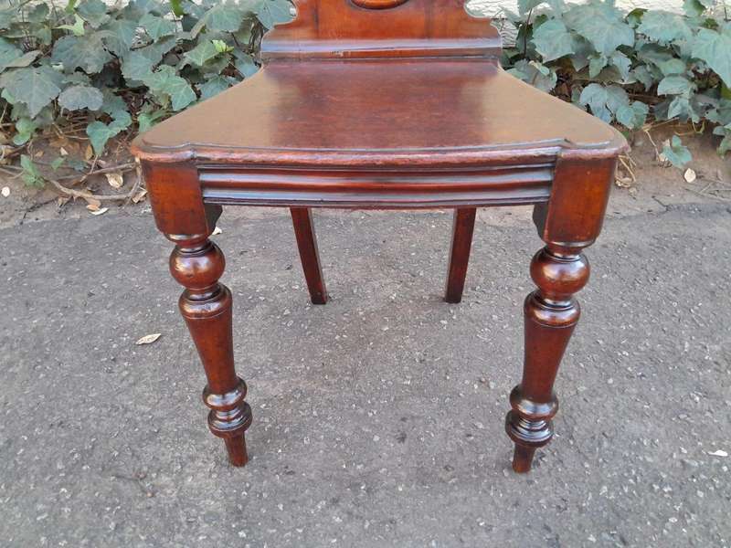 A  20TH Century Pair  of Victorian Carved Mahogany Hall Chairs
