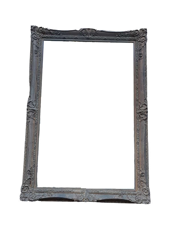 A 20th Century Large And Ornately Carved Gilded And Bevelled Mirror