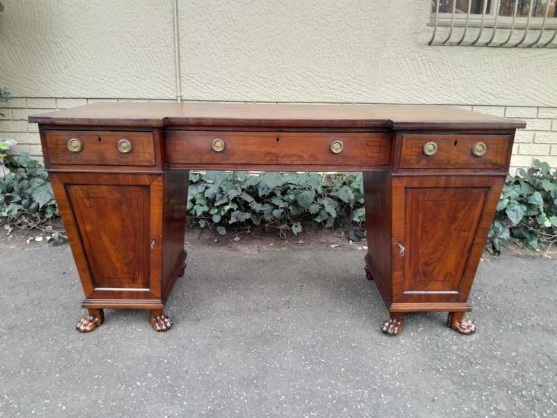 An 18th / 19th Century William IV Mahogany Sideboard With Ebony Inlay And Original Lion Claw Feet...